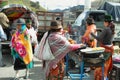 Ecuadorian ethnic people selling cooked food