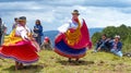 Ecuadorian folk dancers dressed as Cayambe people performance outdoors traditional dance for tourists