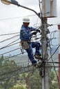 Lineman on a power pole Royalty Free Stock Photo