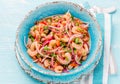 Ecuadorian shrimps ceviche sebiche with tomatoes in blue bowl, wooden blue background. Traditional ecuadorian colombian Royalty Free Stock Photo