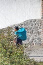 Ecuadorian woman with a load on her back Royalty Free Stock Photo