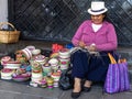 Ecuadorian woman weaving straw basket