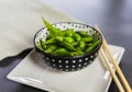 Edamame beans in a bowl with wooden chopsticks. Fresh and healthy green soybeans Royalty Free Stock Photo