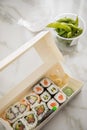 Edamame, salmon, surimi, cucumber and avocado Maki and inside out California sushi with soy sauce, pickled ginger, wasabi and soy Royalty Free Stock Photo