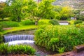 Eden garden fairytale waterfall fountain in the Giardino di Ninfa - Cisterna di Latina - Lazio - Italy