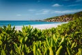 Eden Picturesque Grand Anse, La Digue island, Seychelles. Lush green vegetation frame white sand paradise beach with Royalty Free Stock Photo