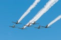 Seven AT-6 Texans Fly Away Trailing Smoke