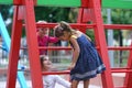 Italian and Greek girls play in a playground