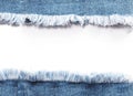 Edge frame of blue denim jeans ripped over white background. Royalty Free Stock Photo