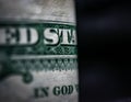 Edge of US Dollar Bill Focused on God