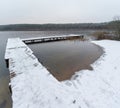 Edge of Wooden Pier, Jetty, Dock at Peaceful Snowy Winter Lake, Silhouette