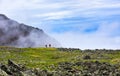 Edge world. Two men standing on edge of hanging valley Royalty Free Stock Photo