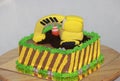 Edible Alloy Excavator Truck Car Vehicles and pile of soil with traffic cone on the chocolate cake