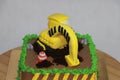 Edible Alloy Excavator Truck Car Vehicles and pile of soil with traffic cone on the chocolate cake