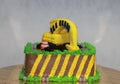 Edible Alloy Excavator Truck Car Vehicles and pile of soil with traffic cone on the chocolate cake