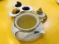 Edible Bird`s nest soup in benjarong bowl served with sweetened side dish in Royalty Free Stock Photo