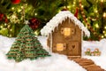 Edible christmas tree and gingerbread house Royalty Free Stock Photo