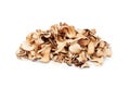 Edible dried mushrooms pile on white background isolated close up, heap of dry boletus edulis, chopped brown cap boletus, sliced Royalty Free Stock Photo