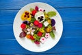 Edible flowers salad in a plate Royalty Free Stock Photo