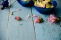 Edible flowers salad in a plate on blue wooden table with fork Royalty Free Stock Photo