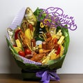 An edible gift in the form of a bouquet consisting of beer, sausages, cheese, beer snacks. Bouquet of beer snacks for men`s birthd