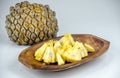 Edible part of marolo, araticum or bruto fruit on wooden bowl . Tropical fruit of the original inhabitants of Brazil and