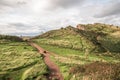 Edinburgh and Arthur& x27;s Seat in a beautiful day, Scotland, United Kingdom. Hills and mountains with path Royalty Free Stock Photo