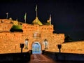 Edinburgh castle at night with the historic red Lion rampant crest - Translation of the latin Nemo me impune lacessit