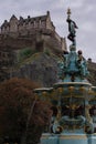 Edinburgh Castle on Castle Rock with blue fountain Royalty Free Stock Photo