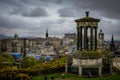 Edinburgh City and Castle, Scotland, viewed from Calton Hill on a cloudy afternoon with the Dugald Stewart monument in Royalty Free Stock Photo