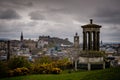 Edinburgh City and Castle, Scotland, viewed from Calton Hill on a cloudy afternoon with the Dugald Stewart monument in Royalty Free Stock Photo