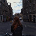 Edinburgh old town, an Irish girl looking out into the streets