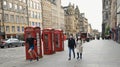 People on the streets of Edinburgh the capital of Scotland built on seven hills