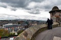 Tourists overlooking scenic view of Edinburgh City from the Esplanade in front of Gatehouse, Edinburgh Castle, Scotland, UK Royalty Free Stock Photo