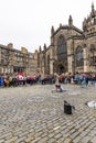 EDINBURGH, SCOTLAND 2022, August 22: Street artist performs in front of St Giles Cathedral