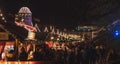 EDINBURGH, SCOTLAND DECEMBER 13, 2018: Panoramic view of illuminated Christmas fair with loads of shining decoration