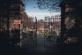 EDINBURGH, SCOTLAND DECEMBER 14, 2018: path to an entrance of a graveyard with a open wrought-iron gate