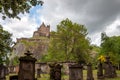 Ancient graveyard tombs with Edinburgh Castle in the background