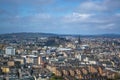 General aerial view from the Holyrood Park to the Edinburgh downtown city, monument buildings, mountains and parks on background Royalty Free Stock Photo