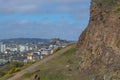 General aerial view from the Holyrood Park to the Edinburgh downtown city, monument buildings, mountains and parks on background Royalty Free Stock Photo