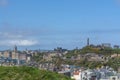 General aerial view from the Holyrood Park to the Edinburgh downtown city, monument buildings, mountains and parks on background Royalty Free Stock Photo