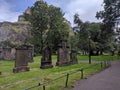 Edinburgh, Scotland, UK graveyard with bright green grass and weathered headstones