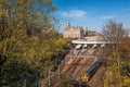 Edinburgh Waverley railway station with trains against Clock Tower building in Scotland, United Kingdom