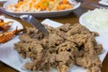 Edirne's fried liver or tava cigeri in Turkish with some appetizer on background