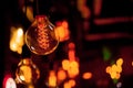 Edison lamp on a black background. Incandescent lightbulb with a dark background with bokeh Royalty Free Stock Photo