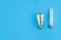 edison lamps on an isolated blue background. Flat lay with copyspace. Concept ecology, save planet earth Royalty Free Stock Photo