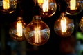 Edison light bulb hanging on a long wire. Cozy warm yellow light.Retro