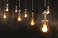Edison light bulbs in front of a wooden wall Royalty Free Stock Photo