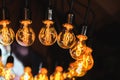 Edison`s lamp in the loft style, a lot of incandescent lamps with patterned tungsten filaments as an interior decoration.