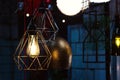 Edison`s light bulb and lamp in modern style. Warm tone light bulb lamp, loft lamps, vintage, retro style. Lamps in coffee shop. E